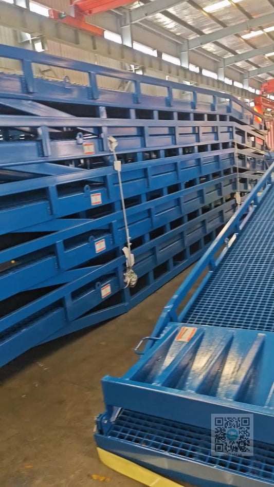 10 Mobile Dock Ramps arranged in two groups of 5, fully assembled and ready for shipment at Beacon Industries factory