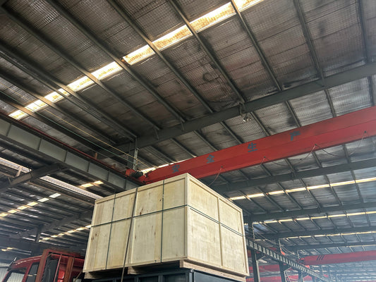 Two 10-ton dock levelers in wooden crate packaging ready for shipment