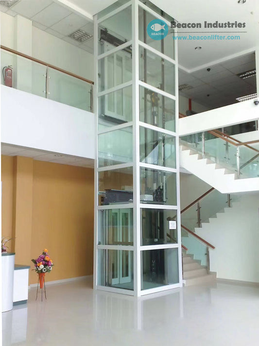 Indoor hydraulic home lift installed in a residential space with custom enclosure design