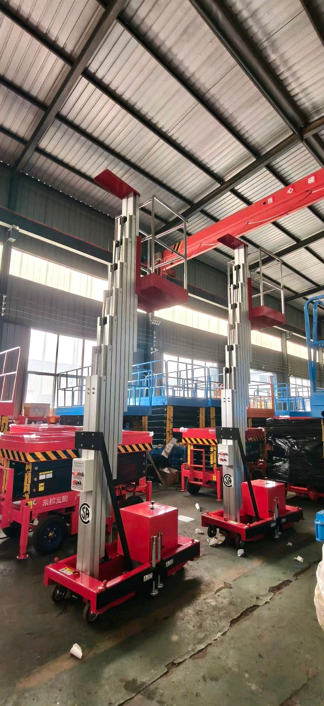 Four aluminum aerial work platforms being prepared for export to the Americas