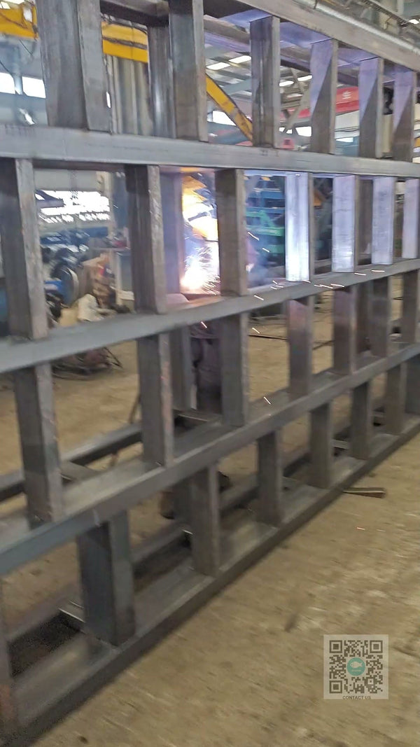 Close-up of mobile dock ramp weld joints being inspected for quality at Beacon Industries factory