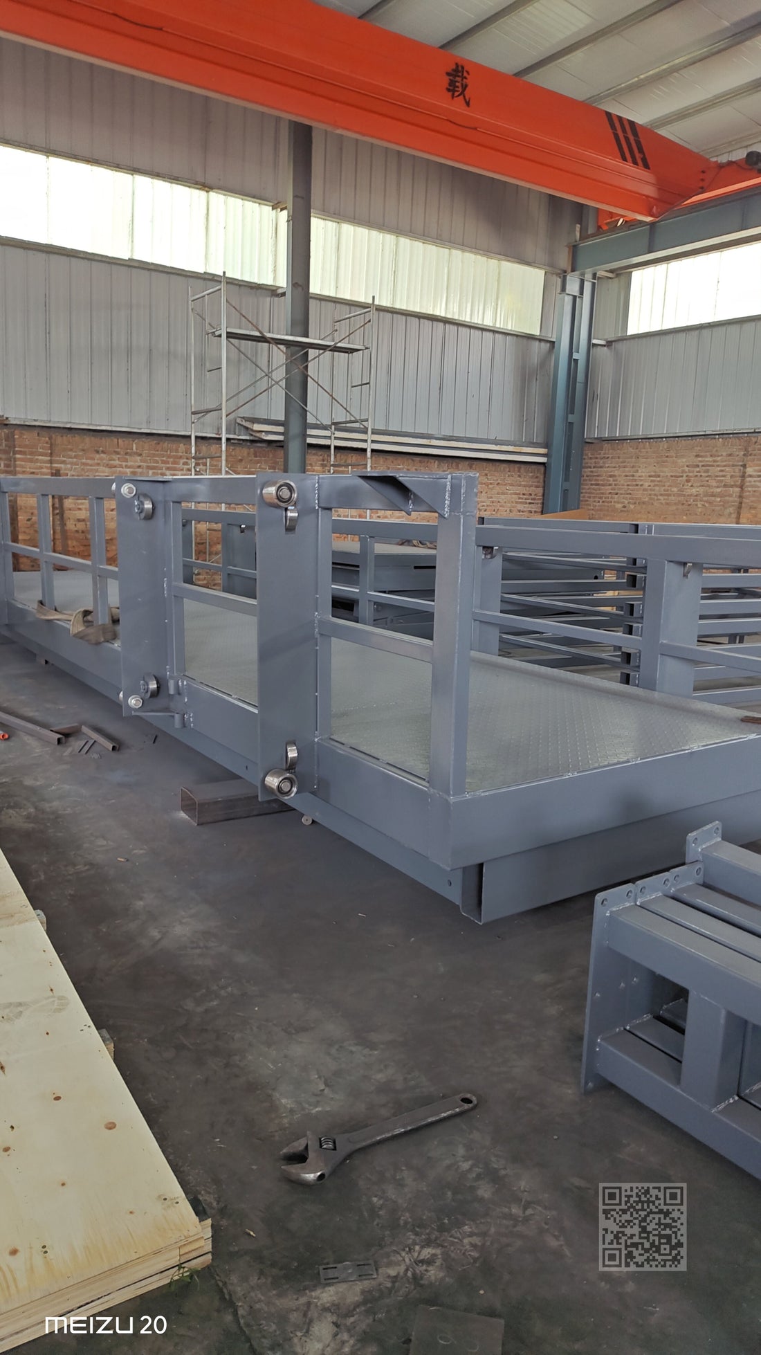 Guide rail lift main structure showing lifting platform and guide rail frame during manufacturing