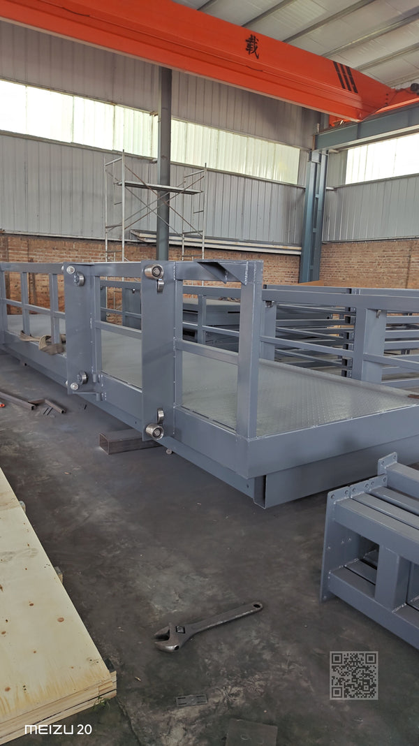 Guide rail lift main structure showing lifting platform and guide rail frame during manufacturing
