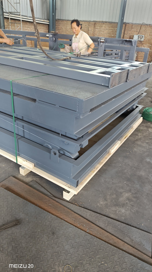 Inspection scissor lift secured on wooden crate base ready for shipment — Beacon Industries factory packaging