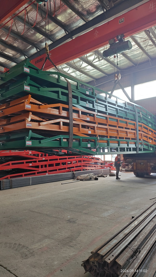 Five Mobile Dock Ramps being loaded into a 40ft High Cube container using overhead cranes for export shipment