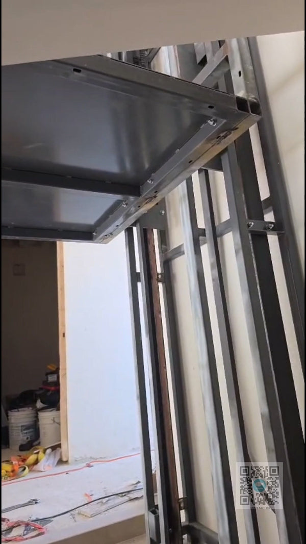 BEACON hydraulic home lift main frame assembled and undergoing manual commissioning test in South America