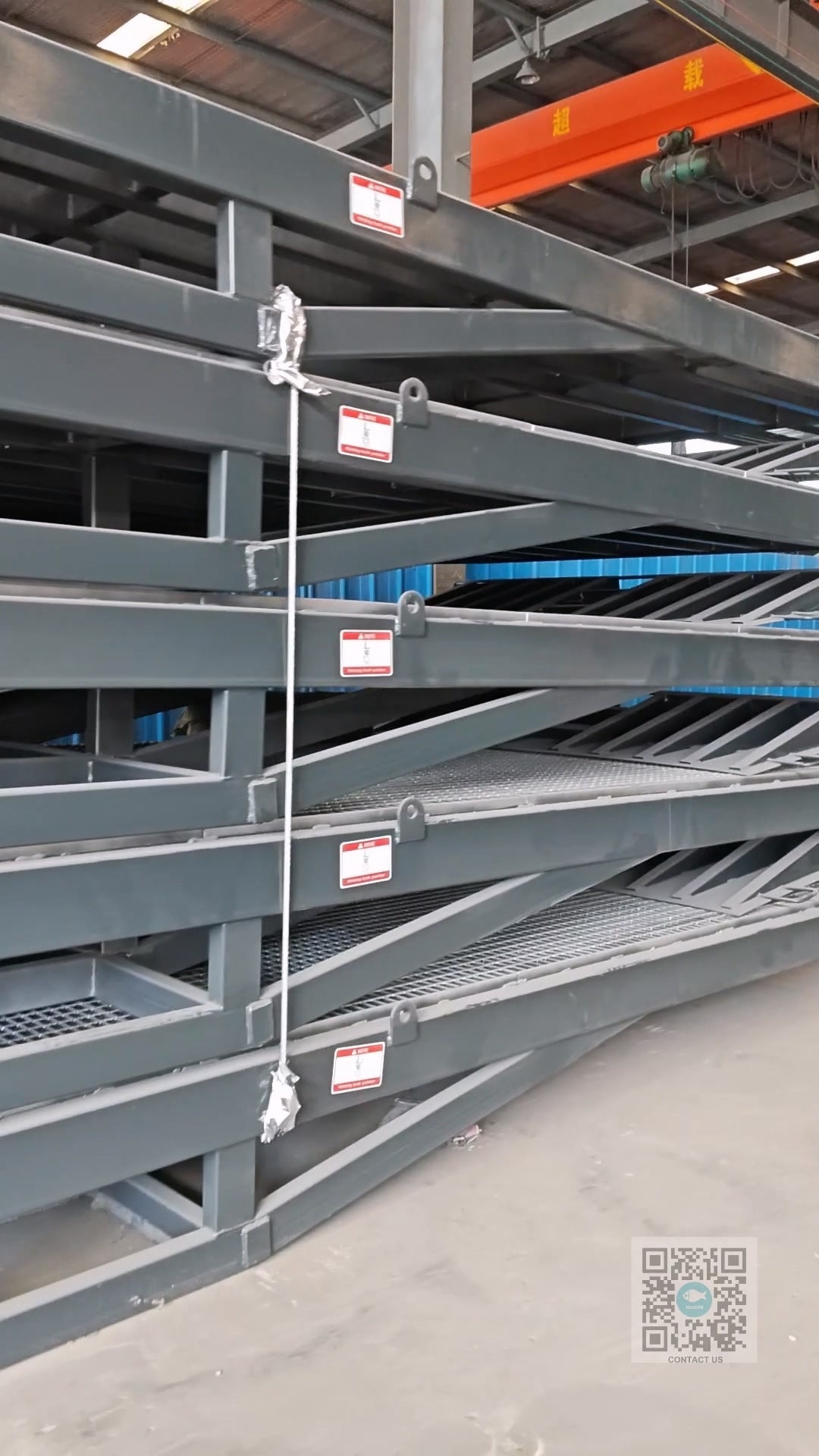 Steel grating platform on a Beacon Industries Mobile Dock Ramp, showing open grating structure for drainage in rainy and snowy weather