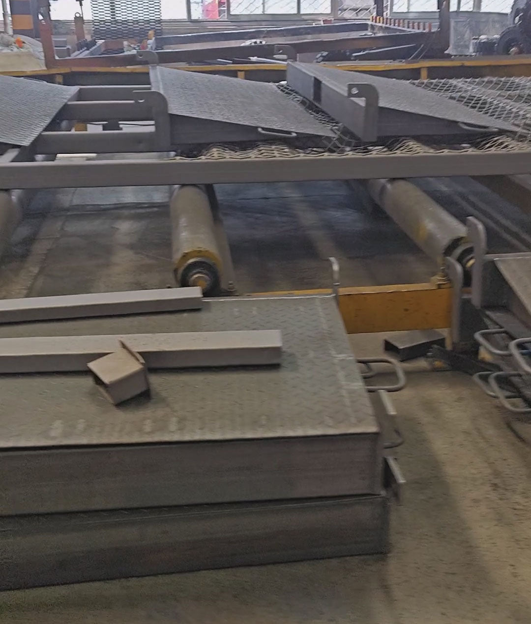 Shot blasting welded steel frames before painting at Beacon Industries lifting equipment factory