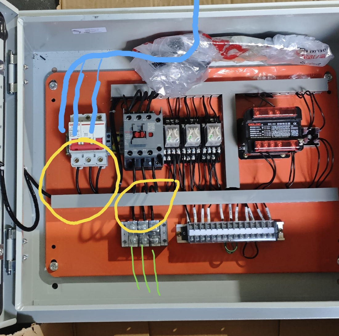 Electrical control box wiring inside a 7.5kW inspection lift showing corrected cable installation